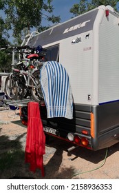 BARCELONA, SPAIN - APRIL 18, 2022: With Laundry Hanging And Children's Bicycles Parked In The Campsite In The Context Of Summer Vacations.