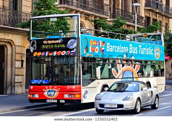 BARCELONA, SPAIN - August 01, 2012: Barcelona City\
Tour red touristic bus, double-decker buses attractions service\
audio guide