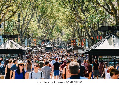 BARCELONA, SPAIN - AUGUST 04, 2016: Crowd Of People In Central Barcelona City On La Rambla Street.