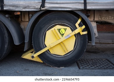 Barcelona, Spain; August 4; 2022: Detail Of The Immobilizer Clamp Placed On The Wheel Of A Truck