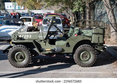 Barcelona, Spain; August 5, 2022: Detail Of An Old Green Jeep Willys Military SUV. Side View
