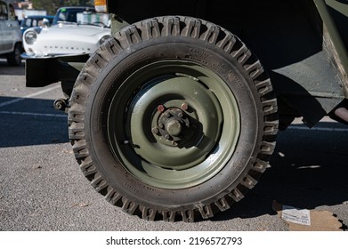 Barcelona, Spain; August 5, 2022: Detail Of An Old Green Jeep Willys Military SUV. Rear Wheel