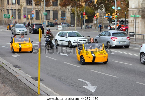 BARCELONA,\
SPAIN - december 12, 2015: GoCar in the streets of Barcelona. GoCar\
is a two-seater, 3 wheeled vehicle for the purpose of being rented\
to tourists as a different way to see a\
city