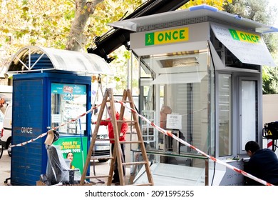 Barcelona, Spain - December 12 2021 - Workers substituting the old "once" lottery booth with new ones.
