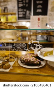 Barcelona, Spain, December 2021-Cozy Hipster Cafe Interior With Bakery Products On Display