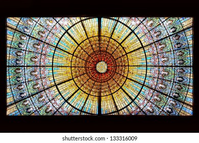 BARCELONA, SPAIN - FEB 3: Palau de la Musica Catalana skylight of stained glass designed by Antoni Rigalt i Blanch whose centerpiece is an inverted dome in shades of gold, on Feb 3, 2013 in Barcelona