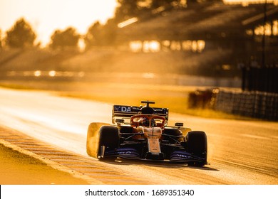 Barcelona, Spain - February 19-21, 2020: 55 SAINZ Carlos (spa), McLaren Renault F1 MCL35, extreme braking on the track during Formula 1 testing at Barcelona circuit in sunset backlight.