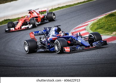 Barcelona, Spain - February 27 / March 2, 2017: Daniil Kvyat, Toro Rosso F1 Team Driver On Track Ahead Of Ferrari At Formula One Testing At Catalunya Circuit In Barcelona, Spain.