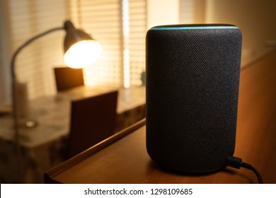 Barcelona, Spain. January 2019: Selective Focus On Amazon Echo Plus Smart Home Device Turning On A Floor Lamp With Alexa Voice Control. Illustrative Editorial