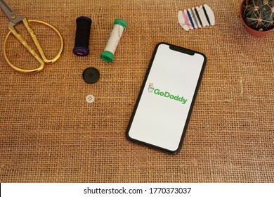 Barcelona, Spain - July 06, 2020; GoDaddy App with Scissor and Sewing Tool. GoDaddy is an Internet domain registrar and web hosting company. #GoDaddy