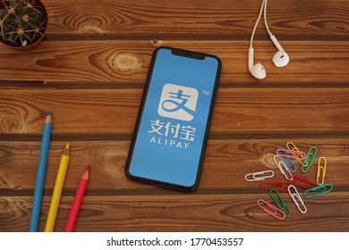 Barcelona, Spain - July 06, 2020; Alipay Iphone Screen with Colored Pencils and Colored Paperclips. Alipay is a third-party mobile and online payment platform by Alipay. #Alipay