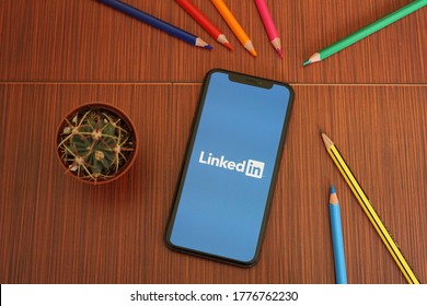 Barcelona, Spain - July 15, 2020; Linkedin Iphone Screen with Colored Pencils and Succulent Plant. LinkedIn is an American business and employment-oriented service. #LinkedIn