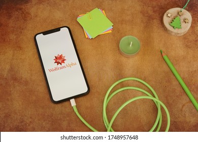 Barcelona, Spain - June 04, 2020; Wolfram Alpha Iphone App With Green Cable And Green Scent Candle. Wolfram Alpha Is A Unique Engine For Computing Answers And Providing Knowledge. #Wolfram Alpha