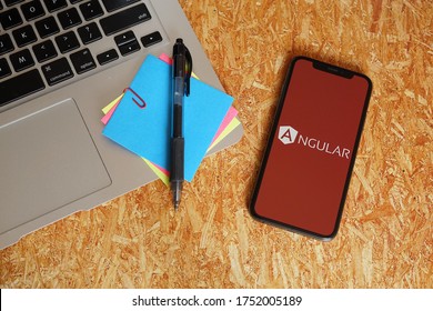 Barcelona, Spain - June 08, 2020; Angular Iphone Screen with Stickynotes on Particle Board. AngularJS is a JavaScript-based open-source front-end web framework. #AngularJS