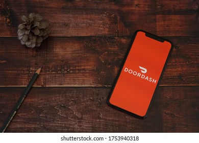 Barcelona, Spain - June 11, 2020; Door Dash Iphone Screen With Pencils And Pine Cone. DoorDash Is A On-demand Prepared Food Delivery Service. 