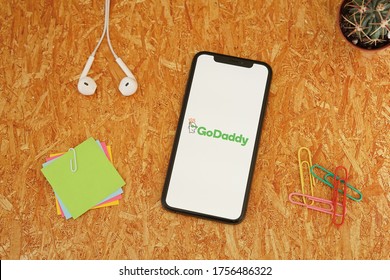 Barcelona, Spain - June 14, 2020; GoDaddy App with Paperclips and Colored Sticky Notes. GoDaddy is an Internet domain registrar and web hosting company. #GoDaddy