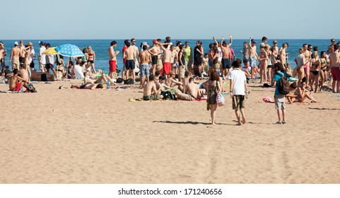 BARCELONA, SPAIN - JUNE 16: Open Air Party On Sand Beach In June 16, 2013 In Barcelona, Spain.  Mediterranean Coast In Catalonia Has Beaches With Entertainment To Suit All Tastes