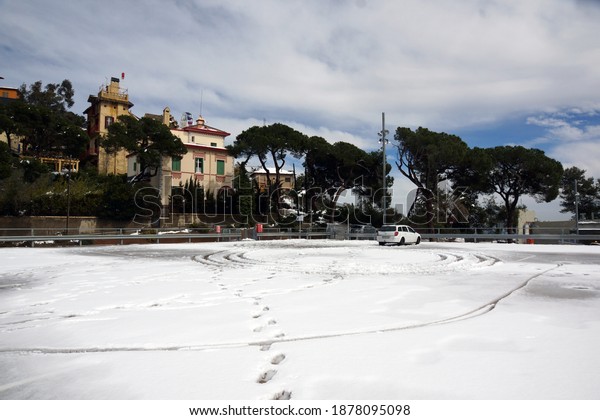 BARCELONA, SPAIN - MARCH 3, 2018: View of\
the snowy parking lot at the top of mount\
Tibidabo