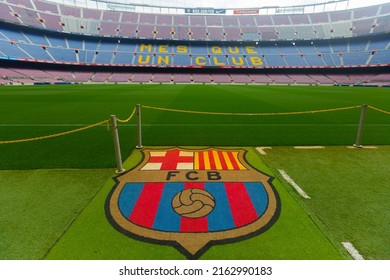 BARCELONA, SPAIN - MAY 23, 2021: Football Club Barcelona Emblem On Grass Of Empty Camp Nou Stadium Field