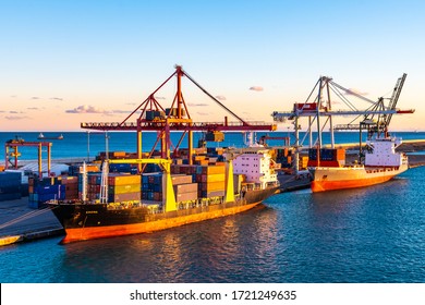 Barcelona, Spain - November 06 2018: Emona Cargo Ship and Renate P Bulk Container Vessel docked at Port of Barcelona. Cranes load/ unload bulk freighter merchant containers at shipping terminal dock. - Shutterstock ID 1721249635