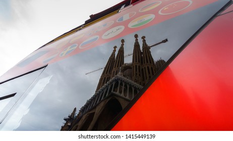 BARCELONA, SPAIN - NOVEMBER 09, 2018 - La Sagrada Familia Church Reflecting In The Tourist Double Decker Bus Front Window