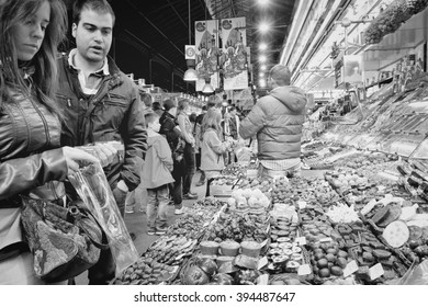 BARCELONA, SPAIN - NOVEMBER 6, 2012: People visit Boqueria market in Barcelona, Spain. Tripadvisor says it is best shopping destination in Barcelona, the most visited city in Spain.
