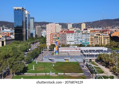 BARCELONA, SPAIN - OCTOBER 8, 2021: Barcelona cityscape with Parc de Joan Miro. The grassy part of the park is also known as Parc de l'Escorxador.