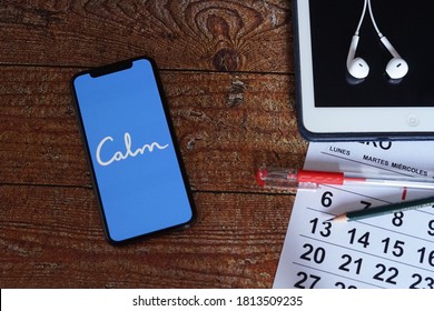 Barcelona, Spain - September 12, 2020; Calm Iphone Screen On A Vintage Table With Calendar And Ipad. Calm Is An App For Sleep, Meditation And Relaxation. 