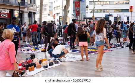 BARCELONA, SPAIN - SEPTEMBER 17, 2019: Sale Of Counterfeit Products At The Rambla Street