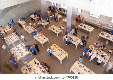 BARCELONA, SPAIN - SEPTEMBER 25: Shoppers Inside The Apple Store On September 25, 2012 In Barcelona, Spain. Apple Is The World's Most Valuable Company By Market Capitalisation.