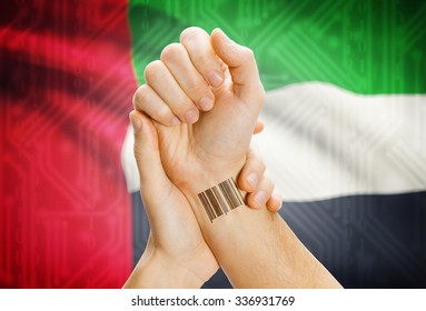 Barcode ID Number On Wrist Of A Human And National Flag On Background - United Arab Emirates