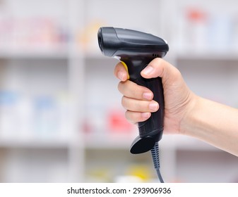 Barcode Scanner In Woman's Hand 