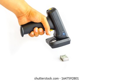 Barcode Scanner With Working Blue Light Scanning Metal Substrates Tag Isolated On White Background. Asian Male Hand Using RFID Portable Device Reader