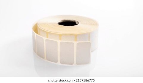 Barcode Sticker Roll For Product Price Isolated On White Background. Blank Adhesive Empty Labels On Bobbin. Paper Tags For Marking And Identification