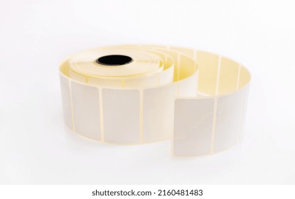 Barcode Sticker Roll For Product Price Isolated On White Background. Blank Adhesive Empty Labels On Bobbin. Paper Tags For Marking And Identification