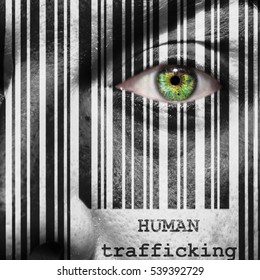 Barcode with the word human trafficking as concept superimposed on a man's face