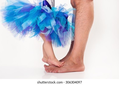 Bare Baby And Dad Feet With Tutu