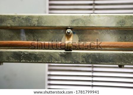 The bare copper cable install entire length of all high voltage cable trays for safety grounding system