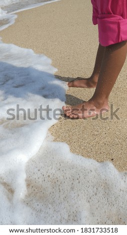 Bare feet by the beach. Selective focus 