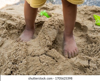 Bare Feet Of Child On Sand. Kid Playing No Shoes Outdoors In Rural Countryside. Fun And Freedom Concept.