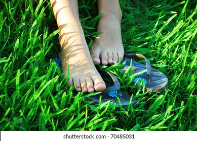 Bare Feet Of Girl On A Grass