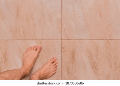 Bare Feet Man Barefoot Stands On The Tile Floor, Top View