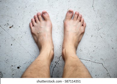 Bare Feet On A Mortar Floor Background Top View