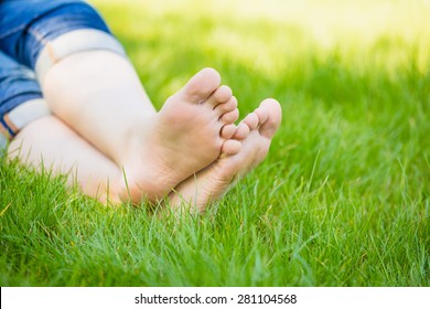 Bare Feet On Spring Grass 