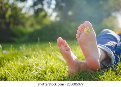 bare feet on spring grass