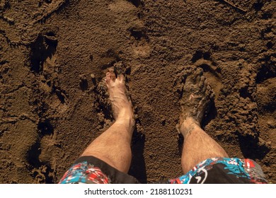 Bare Feet In River Mud From Above