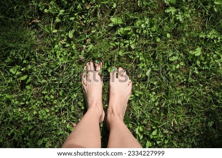 Similar – Feet of a woman wearing sandals