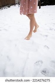 Bare Female Legs Walking Barefoot On Freshly Fallen Snow. Healthy Lifestyle Concept. Improve Your Health, Increase Immunity In The Winter Season. Love Winter