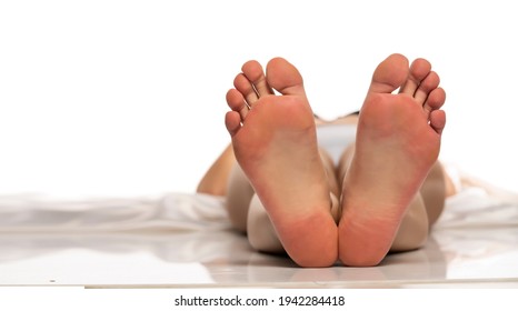 Bare Female Soles On A White Background