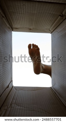 Similar – bare foot at the window